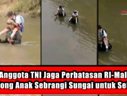 Viral Anggota TNI Jaga Perbatasan RI-Malaysia Gendong Anak Sebrangi Sungai untuk Sekolah