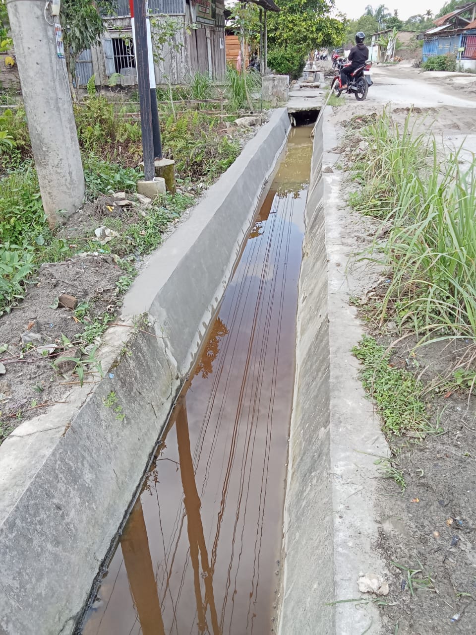 CV AWAI NA Pemenang Tender Proyek Pembangunan Drainase Dari Kantor Camat Sei Dadap menuju Tali Air menjadi Sorotan